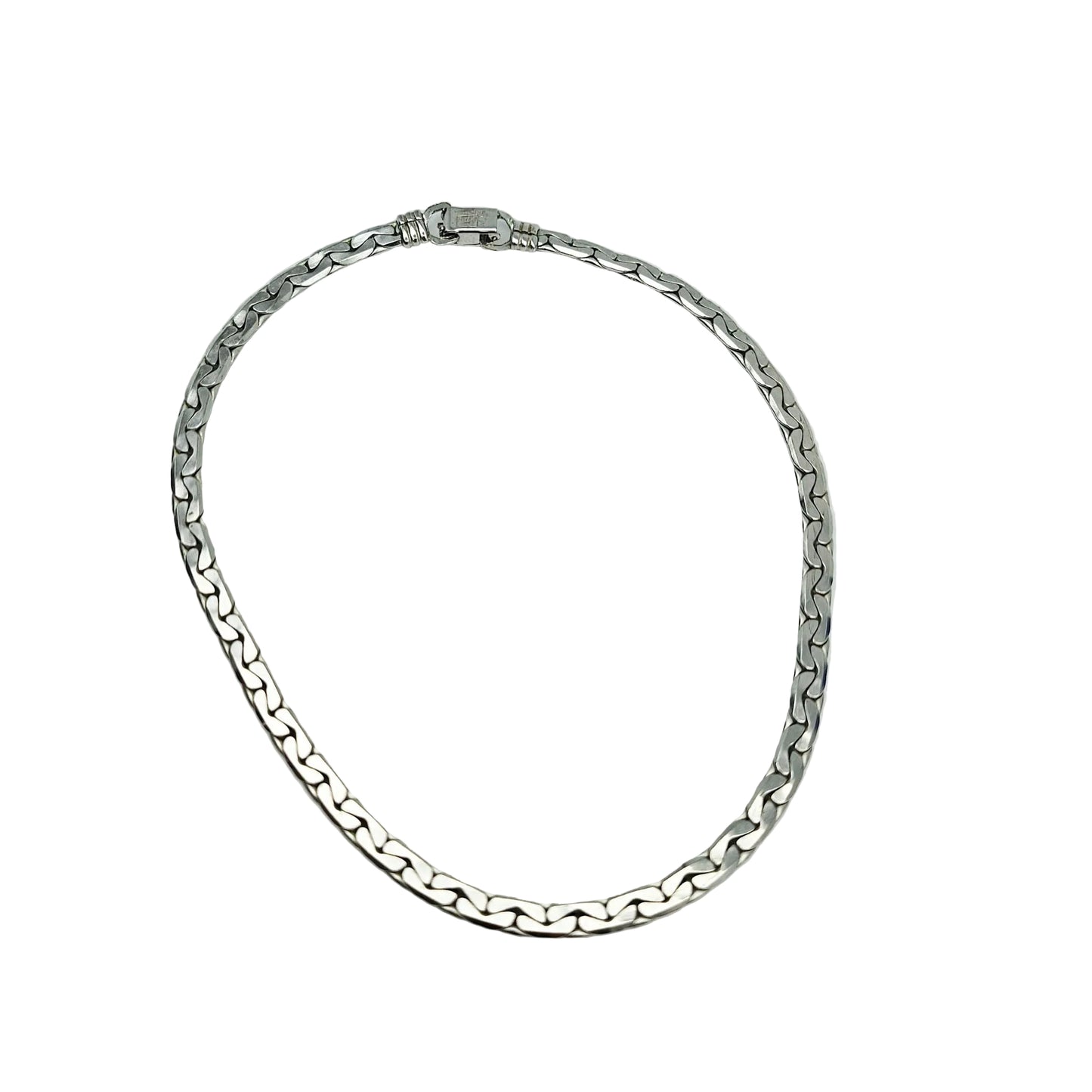 A silver-toned metal chain necklace with a curb-style link pattern, displayed on a plain light gray background.